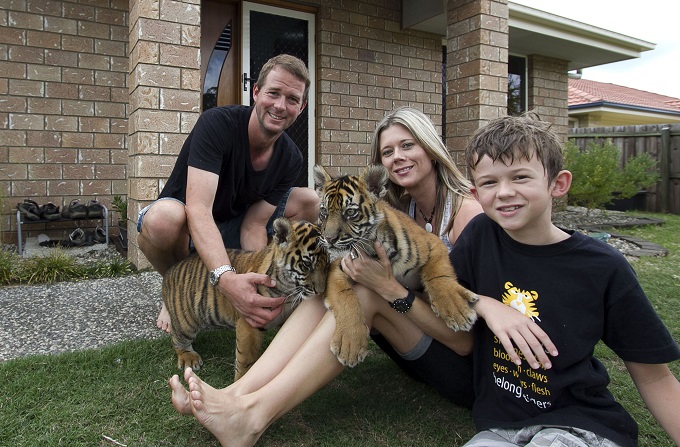 Tigers About the House: Giles, kerri and Kynan outside house with the cubs - Image Credit: BBC