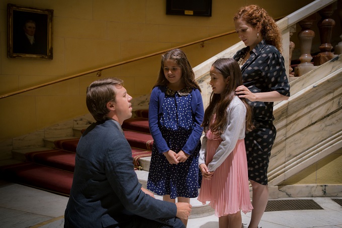 The Honourable Woman - Ephra Stein (Andrew Buchan) with wife Rachel (Katherine Parkinson) with daughters Hannah (Reeve Fletcher) and Mazel (Nicole Lopes) at Stein contract announcement - Image Credit: BBC/Drama Republic. Photographer: Robert Viglasky