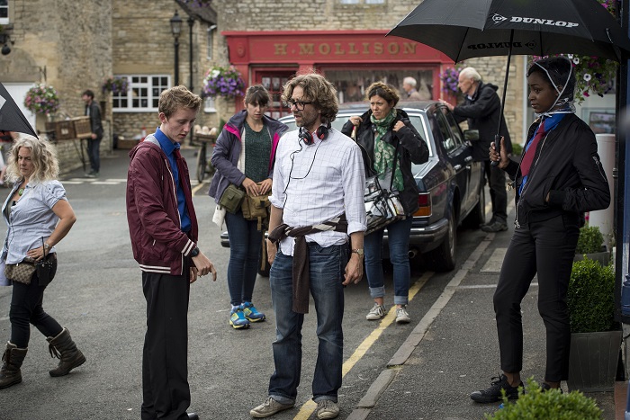 Where was The Casual Vacancy filmed? - Director Jonny Campbell (centre) talks through a scene with Joe Hurst as Andrew 'Arf' Price (left) and Simona Brown as Gaia Bawden (right). - Image Credit: BBC/Bronte Film and Television Ltd. Photographer: Steffan Hill
